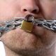 Man with chained mouth